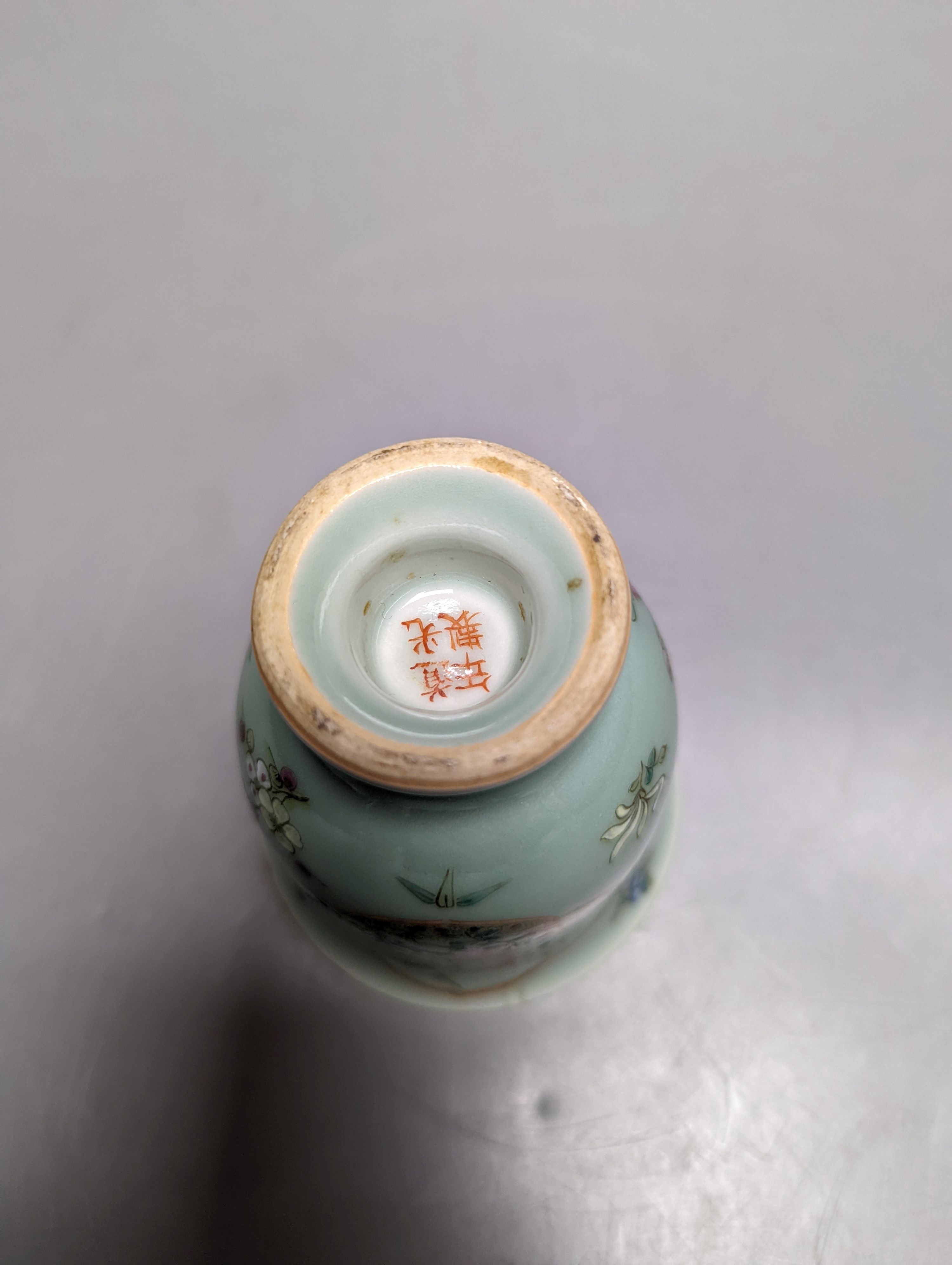 A Chinese celadon ground famille rose cup, Daoquang 10cm